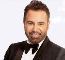 ما هي ديانة عاصي الحلاني